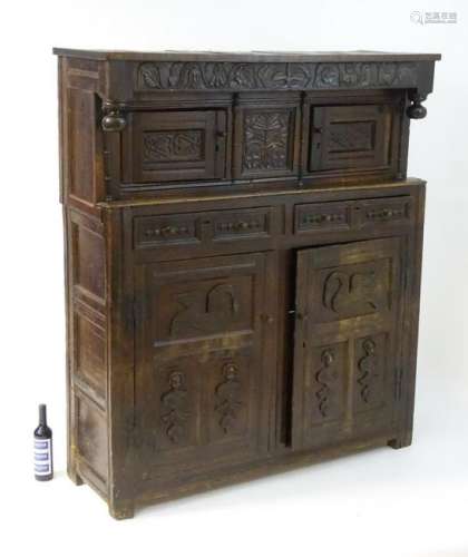 A 17thC and later oak court cupboard with decorative