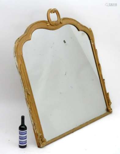 A late 19thC / early 20thC gilt painted mirror with a