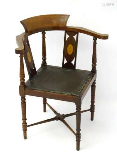 An early 20thC corner chair with marquetry inlay to the