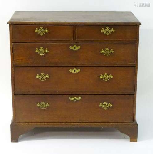 A late 18thC oak chest of drawers comprising two short