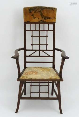A late 19thC walnut Arts & Crafts open armchair with a