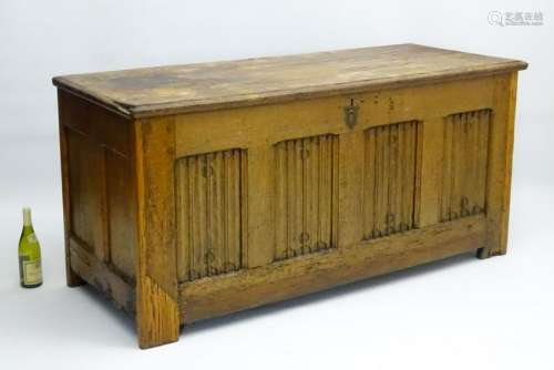 A 17thC oak Coffer of large proportions with a linen