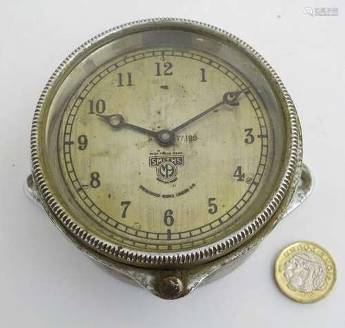 A 1920s bezel wind car / automobile clock: a chromium