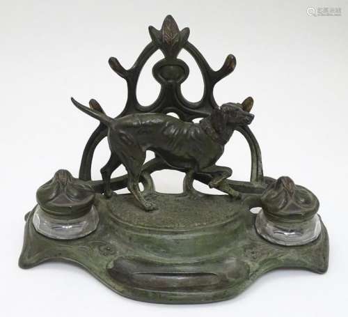 An early - mid 20thC spelter Standish with dog and