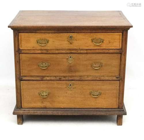 An 18thC oak inlaid chest of drawers with front to back