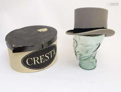 A grey felt top hat in size 7, marked 'Woodrow