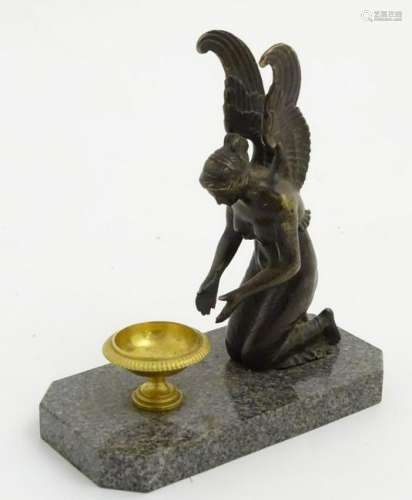 Regency patinated bronze,  An angel kneeling before a