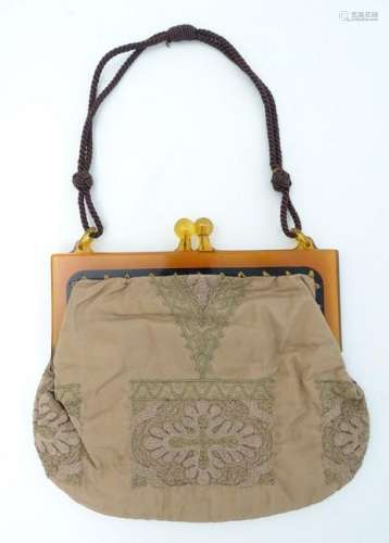 A ladies handbag/purse with an amber coloured celluloid
