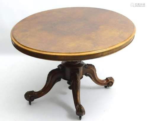 A mid / late 19thC walnut loo table, having an oval