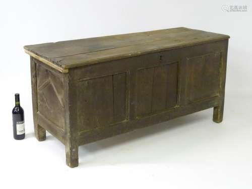 An early 18thC oak coffer with lozenge carved panelled