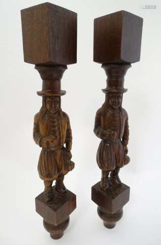A pair of Dutch carved cabinet columns in the form of