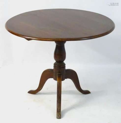 A mid 19thC occasional tripod table with tilt top