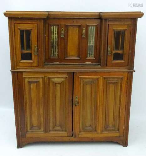 A late 19thC mahogany inverted break front cabinet,