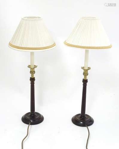 A pair of 21stC table lamps formed as columns with