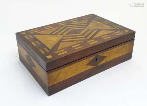 A hardwood box with birds eye maple inlay, a fitted