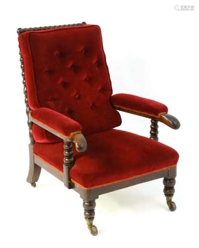 A mid 19thC mahogany open armchair chair with a bobbin