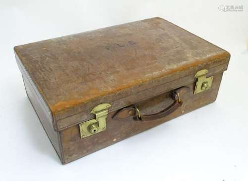 An old fitted leather case with brass furniture and