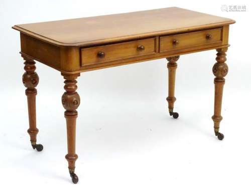 A Victorian mahogany side table with two short drawers