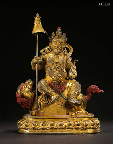 TIBETAN GILT BRONZE SEATED GOD OF WEALTH ON LION