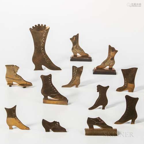 Twelve Brass High-top Shoe-form Items