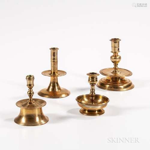 Four Early Brass Candlesticks