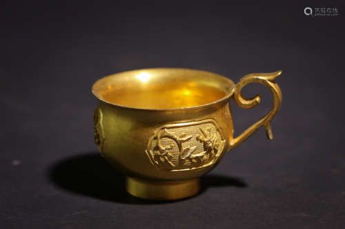 A Chinese Gilt Bronze Cup with Handle